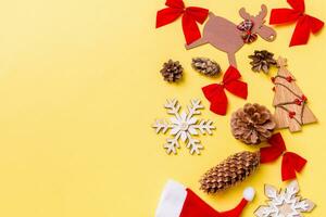 Christmas yellow background with holiday toys and decorations. Happy New Year concept with empty space for your design photo