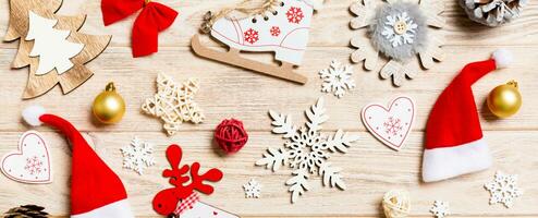 Top view Banner of Christmas toys on wooden background. New Year ornament. Holiday concept photo