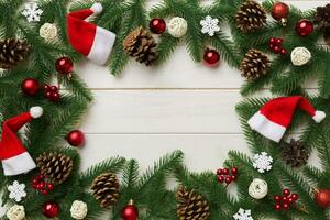 Christmas background with fir branches and Christmas decor. Top view, copy space for text photo