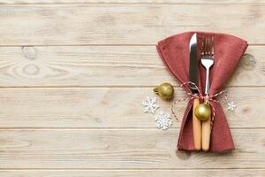 Christmas table place setting with knife, napkin and fork. Holidays new year background with copy space photo