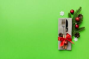 Christmas table place setting with knife, napkin and fork. Holidays new year background with copy space photo