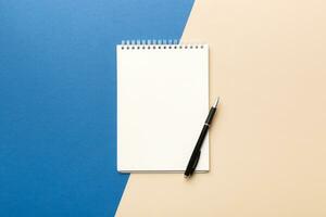 Blank notebook with pen on white background. Back to school and education concept photo