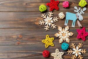 Top view of Christmas decorations and toys on wooden background. Copy space. Empty place for your design. New Year concept photo