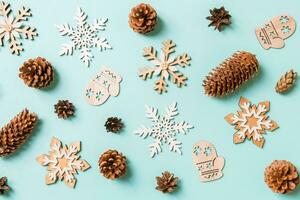 Top view of holiday toys and decorations on blue Christmas background. New Year time concept photo