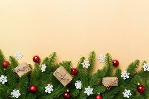 Christmas decorations and fir tree branch and gift boxon dark table. Top view frame with copy space photo