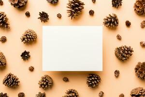 Creative frame made of Christmas pine cones with square Paper blank. Xmas and New Year theme. Flat lay, top view copy space photo