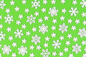 Set of white snowflakes on colorful background. Top view of Christmas ornament. New Year time concept with empty space for your design photo
