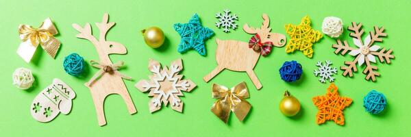 Top view Banner of green background with New Year toys and decorations. Christmas time concept with copy space photo