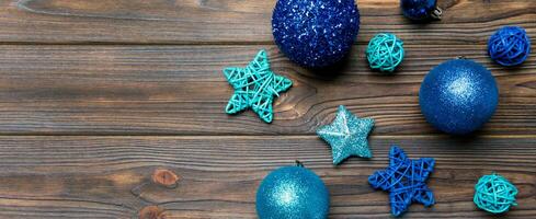 Top view Banner of festive winter composition on wooden background with empty space for your design. Christmas baubles and decorations. New Year concept photo