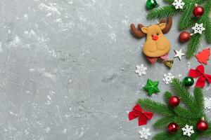 Christmas background with fir branches and Christmas decor. Top view, copy space for text photo