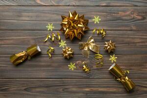 Christmas crackers with shiny confetti on color background, top view, copy space photo