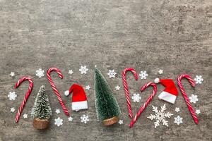 Flat lay composition with christmas trees on color background. Top view with copy space photo