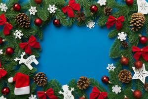 Christmas background with fir branches and Christmas decor. Top view, copy space for text photo