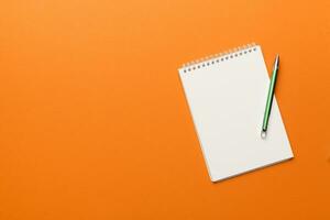 Blank notebook with pen on white background. Back to school and education concept photo