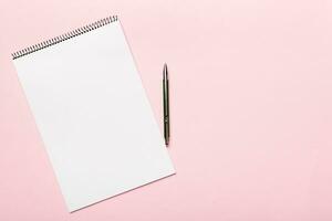 Blank notebook with pen on white background. Back to school and education concept photo