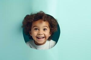 A boy smiles against a pastel background with holes in advertising style photo