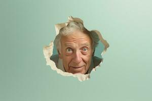 A senior man smiles against a pastel background with holes in advertising style photo