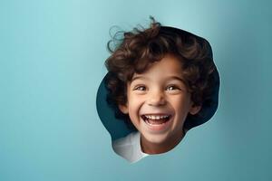 A boy smiles against a pastel background with holes in advertising style photo