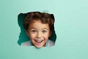 A boy smiles against a pastel background with holes in advertising style photo