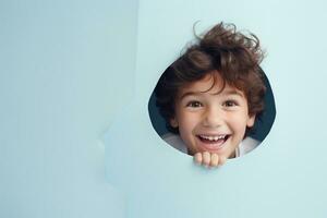 A boy smiles against a pastel background with holes in advertising style photo