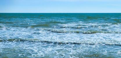 Calm ocean waves on a clear day sea and horizon image of sea waves and sky photo