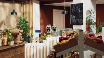 Panning shot of low carbon footprint zero waste supermarket with fruits, vegetables, grains, spices and pasta on display. Empty environmentally conscious local grocery store video