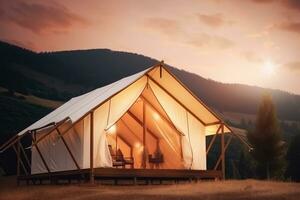 Stylish glamping tent in mountains at sunset. Generative AI photo