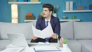 Man looking at documents is tense and stressed. video