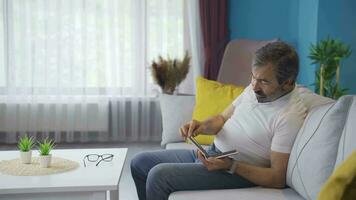 Divorced man is sad and looking at album. video