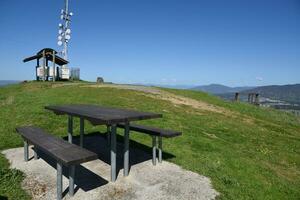 Bandiana, Victoria, Australia - 17 September 2023 - Park bench picnic area at Huon Hill lookout Rising 263 metres above the Murray and Kiewa floodplains, offers spectacular views of Lake Hume. photo