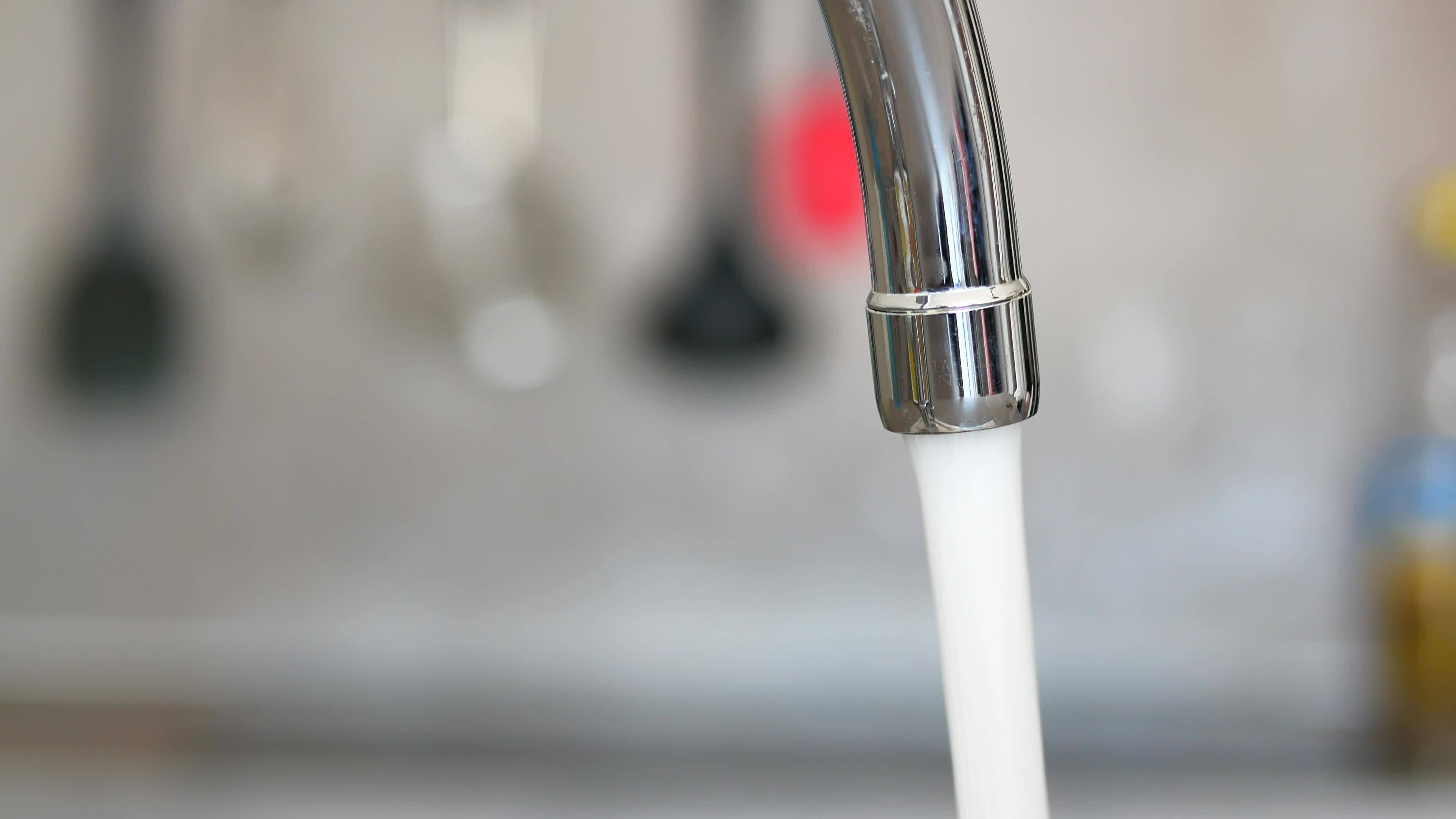 water pouring from a faucet tap slow motion 32327909 Stock Video at