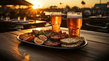 Two glasses of beer on the table in a restaurant at sunset in evening Ibiza. photo