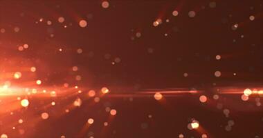 Abstract background of yellow orange gold glowing particles and bokeh dots of festive energy magic photo
