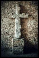Ancient Christian Cross Sculpture in a Medieval Church photo