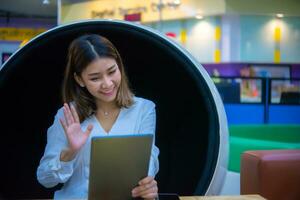 Her happy expression suggests that she is successful in her digital marketing efforts and that her clients are satisfied with the results. photo