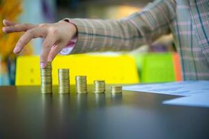 Businesswoman picks up the first stack of coins from the left, Digital money concept, Finance and management concept, Business for future concept. photo