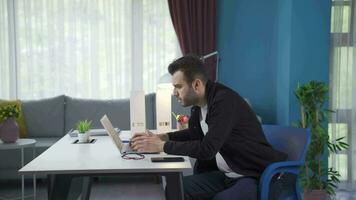 Freelance businessman seeing his failure on laptop. video