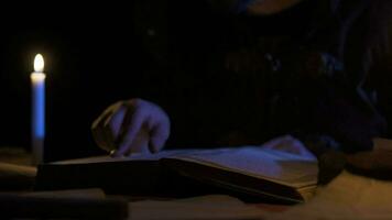 Historical period book by candlelight. video