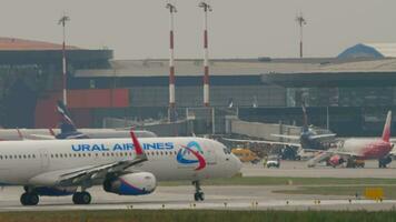 MOSCOW, RUSSIAN FEDERATION JULY 30, 2021 - Passenger plane of Ural Airlines on the taxiway at Sheremetyevo airport video