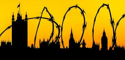 Silhouette of Houses of Parliament, Westminster, London superimposed with barbed wire photo