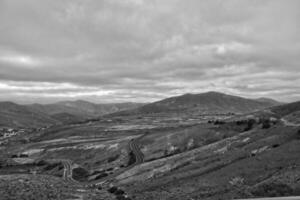 empty mysterious mountainous landscape from the center of the Canary Island Spanish Fuerteventura with a cloudy sky photo