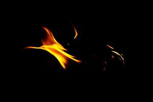 Fire flame texture. Burning material backdrop. Burn effect pattern. Blaze and torch wallpaper. Heat and haze backdrop. photo