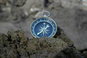 Compass on the rock photo