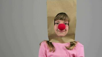 a girl wearing a paper bag on her head video