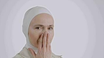 a woman covering her face with her hands video