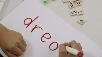 a child writing dream on a piece of paper video