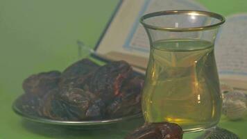 dates and oil beside the holy book. The concept of fasting in ramadhan video