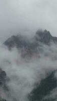 a mountain range with clouds over it video