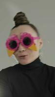 portrait of a woman wearing a party sunglasses video