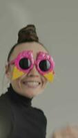 portrait of a woman wearing a party sunglasses video